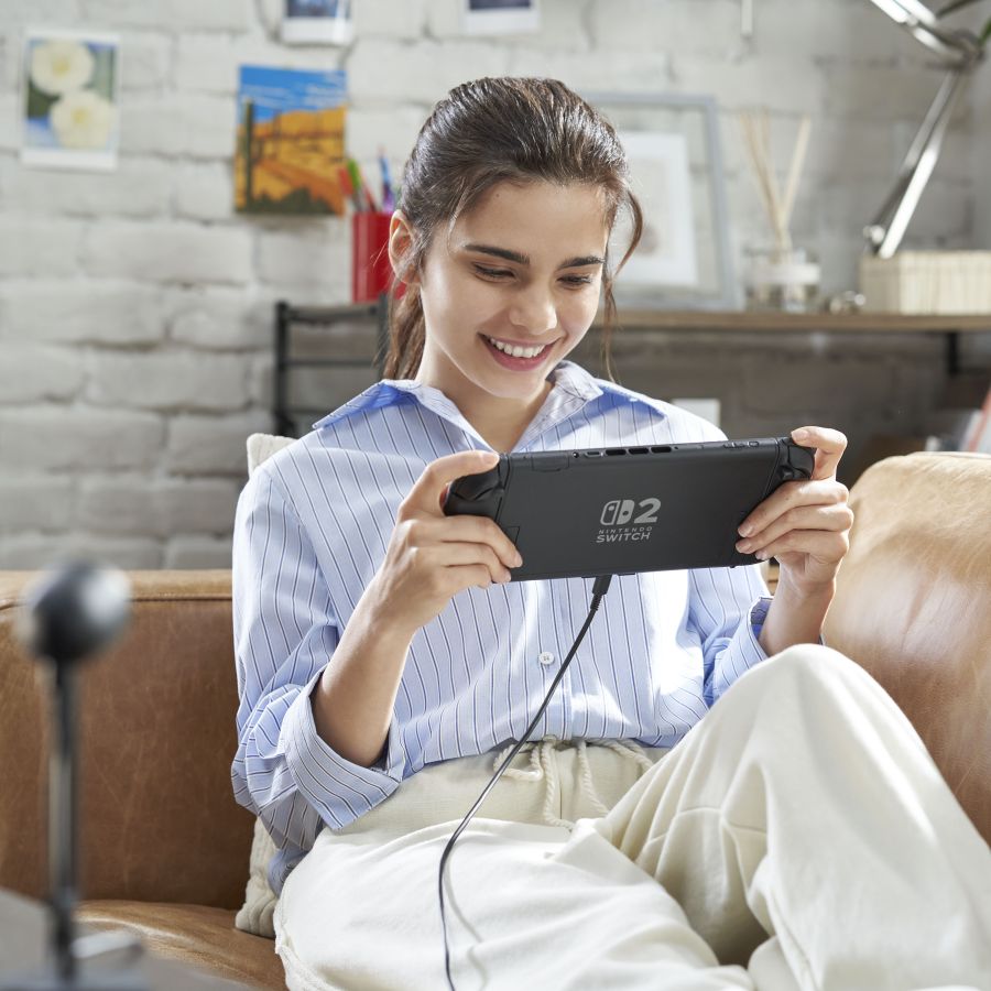 Girl playing Nintendo Switch 2 in handheld mode